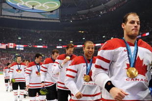 VANCOUVER, BC - FEBRUARY 28:  Team Canada players file off the ice after receiving the gold medals won during the ice hockey men's gold medal game between USA and Canada on day 17 of the Vancouver 2010 Winter Olympics at Canada Hockey Place on February 28, 2010 in Vancouver, Canada.  (Photo by Harry How/Getty Images)