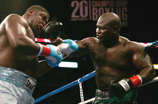 LOS ANGELES, CA - SEPTEMBER 02:  (R-L) James Toney hits  Samuel Peter with a right during their WBC heavyweight title elimination/NABF & IBA heavyweight championship fight at Staples Center on September 2, 2006 in Los Angeles, California.  (Photo by Donald Miralle/Getty Images)