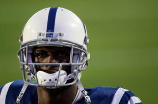 MIAMI GARDENS, FL - FEBRUARY 07:  Reggie Wayne  #87 of the Indianapolis Colts warms up on the field before playing against the New Orleans Saints in Super Bowl XLIV on February 7, 2010 at Sun Life Stadium in Miami Gardens, Florida.  (Photo by Elsa/Getty Images)