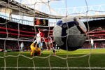 LONDON, ENGLAND - MARCH 06:  Cesc Fabregas of Arsenal slots the ball under Brian Jensen of Burnley to score during the Barclays Premier League match between Arsenal and Burnley at Emirates Stadium on March 6, 2010 in London, England.  (Photo by Mike Hewitt/Getty Images)