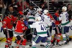 CHICAGO - MARCH 05:  A melee breaks out between the Chicago Blackhawks and the Vancouver Canucks in the first minute of play after Andrew Ladd of the Blackhawks and Ryan Kesler of the Canucks start a fight at the United Center on March 5, 2010 in Chicago, Illinois. (Photo by Jonathan Daniel/Getty Images)