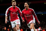 LONDON, ENGLAND - MARCH 09:  Samir Nasri (R) of Arsenal celebrates with teammate Nicklas Bendtner after scoring his team's third goal during the UEFA Champions League round of 16 match between Arsenal and FC Porto at the Emirates Stadium on March 9, 2010 in London, England.  (Photo by Mike Hewitt/Getty Images)