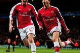 LONDON, ENGLAND - MARCH 09:  Samir Nasri (R) of Arsenal celebrates with teammate Nicklas Bendtner after scoring his team's third goal during the UEFA Champions League round of 16 match between Arsenal and FC Porto at the Emirates Stadium on March 9, 2010 in London, England.  (Photo by Mike Hewitt/Getty Images)