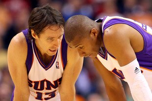 PHOENIX - DECEMBER 30:  Steve Nash #13 of the Phoenix Suns talks with Leandro Barbosa #10 during the NBA game against the Boston Celtics at US Airways Center on December 30, 2009 in Phoenix, Arizona. The Suns defeated the Celtics 116-98.  NOTE TO USER: User expressly acknowledges and agrees that, by downloading and or using this photograph, User is consenting to the terms and conditions of the Getty Images License Agreement.  (Photo by Christian Petersen/Getty Images)