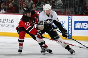 NEWARK, NJ - DECEMBER 30:  Rod Pelley #10 of the New Jersey Devils battles against Sergei Gonchar #55 of the Pittsburgh Penguins at the Prudential Center on December 30, 2009 in Newark, New Jersey.  (Photo by Bruce Bennett/Getty Images)