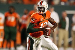 MIAMI GARDENS, FL - SEPTEMBER 17:  Quarterback Jacory Harris #12 of the Miami Hurricanes scrambles against the Georgia Tech Yellow Jackets at Land Shark Stadium on September 17, 2009 in Miami Gardens, Florida. Miami defeated Georgia Tech 33-17.  (Photo by Doug Benc/Getty Images)