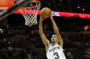 SAN ANTONIO - JANUARY 22:  Guard George Hill #3 of the San Antonio Spurs gets the slam dunk against the Houston Rockets at AT&T Center on January 22, 2010 in San Antonio, Texas.  (Photo by Ronald Martinez/Getty Images)