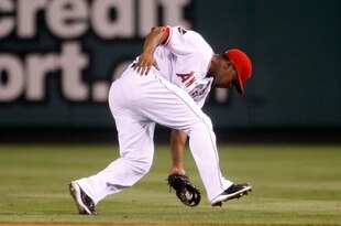 ANAHEIM, CA - SEPTEMBER 29:  Howie Kendrick #47 of the Los Angeles Angels of Anaheim fields a ground ball by Ivan Rodriguez of the Texas Rangers in the seventh inning at Angel Stadium on September 29, 2009 in Anaheim, California. The Angels defeated the Rangers 5-2.  (Photo by Jeff Gross/Getty Images)