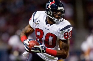 ST. LOUIS - DECEMBER 20:  Andre Johnson #80 of the Houston Texans carries the ball during the game against the St. Louis Rams at Edward Jones Dome on December 20, 2009 in St. Louis, Missouri.  (Photo by Dilip Vishwanat/Getty Images)