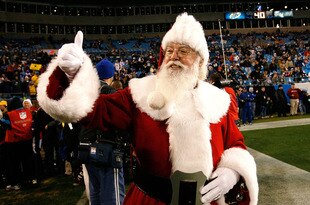CHARLOTTE, NC - DECEMBER 20:  Santa Claus walks onto the field before the game against the Minnesota Vikings and the Carolina Panthers at Bank of America Stadium on December 20, 2009 in Charlotte, North Carolina.  (Photo by Kevin C. Cox/Getty Images)