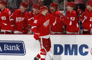 DETROIT - MARCH 11: Tomas Holmstrom #96 of the Detroit Red Wings celebrates with teammates after a first period goal against the Minnesota Wild on March 11, 2010 at Joe Louis Arena in Detroit, Michigan. (Photo by Gregory Shamus/Getty Images)