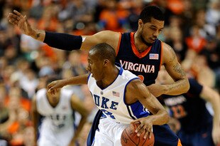 GREENSBORO, NC - MARCH 12:  Nolan Smith #2 of the Duke Blue Devils drives around Mike Scott #32 of the University of Virginia Cavaliers in their quarterfinal game in the 2010 ACC Men's Basketball Tournament at the Greensboro Coliseum on March 12, 2010 in Greensboro, North Carolina.  (Photo by Jeff Zelevansky/Getty Images)