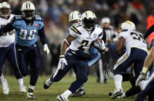 NASHVILLE, TN - DECEMBER 25: LaDainian Tomlinson #21 of the San Diego Chargers carries for a gain during the first half against the Titans on December 25, 2009 at LP Field in Nashville, Tennessee. (Photo by Rex Brown/Getty Images)