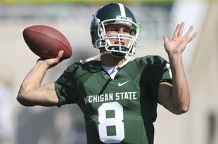 EAST LANSING, MI - SEPTEMBER 05:  Quarterback Kirk Cousins #8 of the Michigan State Spartans warms up prior to the start of the game against the Montana State Bobcats on September 5, 2009 at Spartan Stadium in East Lansing, Michigan.  (Photo by Leon Halip/Getty Images)