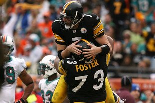 MIAMI - JANUARY 03:  Quarterback Ben Roethlisberger #7 of the Pittsburgh Steelers is lifted into the air by offensive linemen Ramon Foster #73 after Roethlisberger's touchdown pass to tight end Heath Miller #83 in the third quarter against the Miami Dolphins at Land Shark Stadium on January 3, 2010 in Miami, Florida. The Steelers defeated the Dolphins 30-24.  (Photo by Doug Benc/Getty Images)