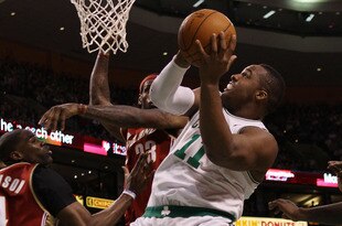 BOSTON - FEBRUARY 25:  Glen Davis #11 of the Boston Celtics goes up for two as LeBron James #23 of the Cleveland Cavaliers defends at the TD Garden on February 25, 2010 in Boston, Massachusetts. The Cavaliers defeated the Celtics 108-88.  NOTE TO USER: User expressly acknowledges and agrees that, by downloading and or using this photograph, User is consenting to the terms and conditions of the Getty Images License Agreement.  (Photo by Elsa/Getty Images)