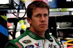 ATLANTA - MARCH 05:  Carl Edwards, driver of the #99 Scotts Ford, stands in the garage during practice for the NASCAR Sprint Cup Series Kobalt Tools 500 at Atlanta Motor Speedway on March 5, 2010 in Hampton, Georgia.  (Photo by Tom Whitmore/Getty Images for NASCAR)