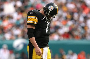 MIAMI - JANUARY 03:  Quarterback Ben Roethlisberger #7 of the Pittsburgh Steelers walks back to the huddle after injuring his shoulder in the fourth quarter against the Miami Dolphins at Land Shark Stadium on January 3, 2010 in Miami, Florida. The Steelers defeated the Dolphins 30-24.  (Photo by Doug Benc/Getty Images)
