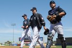 TAMPA, FL - MARCH 5: Pitcher Phil Hughes #65 (middle) of the New York Yankees walks to the dugout before play against the Tampa Bay Rays March 5, 2010 at the George M. Steinbrenner  Field in Tampa, Florida. (Photo by Al Messerschmidt/Getty Images) 