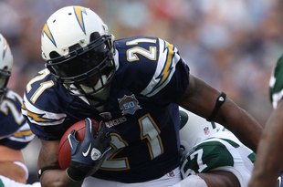 SAN DIEGO - JANUARY 17:  Running back LaDainian Tomlinson #21 of the San Diego Chargers runs with the ball against the New York Jets during the AFC Divisional Playoff Game at Qualcomm Stadium on January 17, 2010 in San Diego, California.  (Photo by Donald Miralle/Getty Images)