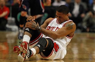 CHICAGO - MARCH 01: Derrick Rose #1 of the Chicago Bulls grabs his knee following collision in the first quarter of a game against the Atlanta Hawks at the United Center on March 1, 2010 in Chicago, Illinois. NOTE TO USER: User expressly acknowledges and agrees that, by downloading and/or using this Photograph, User is consenting to the terms and conditions of the Getty Images License Agreement.  (Photo by Jonathan Daniel/Getty Images)