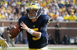 ANN ARBOR, MI - SEPTEMBER 5:  Tate Forcier #5 of the Michigan Wolverines rolls out during the game against the Western Michigan Broncos on September 5, 2009 at Michigan Stadium in Ann Arbor, Michigan. (Photo by Gregory Shamus/Getty Images) 