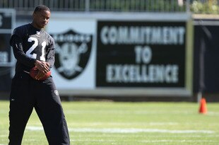 NAPA, CA - AUGUST 05:  Nnamdi Asomugha #21 looks on during the Oakland Raiders Training Camp at the Napa Valley Marriott on August 5, 2009 in Napa, California.  (Photo by Jed Jacobsohn/Getty Images)