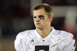 PALO ALTO, CA - NOVEMBER 28:  Jimmy Clausen #7 of the Notre Dame Fighting Irish walks the sideline during their game against the Stanford Cardinal at Stanford Stadium on November 28, 2009 in Palo Alto, California.  (Photo by Ezra Shaw/Getty Images)