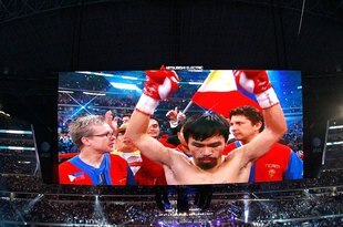 ARLINGTON, TX - MARCH 13:  Manny Pacquiao of the Philippines in the ring before taking on Joshua Clottey of Ghana during the WBO welterweight title fight at Cowboys Stadium on March 13, 2010 in Arlington, Texas.  (Photo by Tom Pennington/Getty Images)