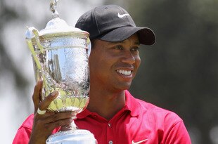 SAN DIEGO - JUNE 16:  Tiger Woods celebrates with the trophy after winning on the first sudden death playoff hole during the playoff round of the 108th U.S. Open at the Torrey Pines Golf Course (South Course) on June 16, 2008 in San Diego, California.  (Photo by Ross Kinnaird/Getty Images)
