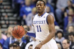 NASHVILLE, TN - MARCH 14:  John Wall #11 of the Kentucky Wildcats brings the ball up court against the Mississippi State Bulldogs during the final of the SEC Men's Basketball Tournament at the Bridgestone Arena on March 14, 2010 in Nashville, Tennessee. Kentucky won 75-74 in overtime. (Photo by Andy Lyons/Getty Images)