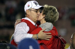 PASADENA, CA - JANUARY 01:  Head coach Jim Tressel of the Ohio State Buckeyes celebrates with his wife Ellen after the buckeyes 26-17 win over the Oregon Ducks in the 96th Rose Bowl game on January 1, 2010 in Pasadena, California.  (Photo by Stephen Dunn/Getty Images)