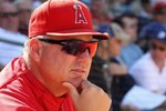 SURPRISE, AZ - MARCH 13:  Manager Mike Scioscia of the Los Angeles Angels of Anaheim looks on during the MLB spring training game against the Kansas City Royals at Surprise Stadium on March 13, 2010 in Surprise, Arizona.  The Royals defeated the Angels 12-3.  (Photo by Christian Petersen/Getty Images)