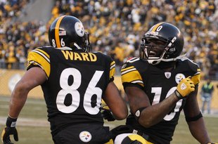 PITTSBURGH - DECEMBER 06:  Hines Ward #86 and Santonio Holmes #10 of the Pittsburgh Steelers celebrate during the game against the Oakland Raiders on December 6, 2009 at Heinz Field in Pittsburgh, Pennsylvania.  (Photo by Gregory Shamus/Getty Images)