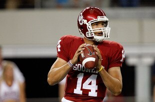ARLINGTON, TX - SEPTEMBER 05:  Quarterback Sam Bradford #14 of the Oklahoma Sooners drops back to pass against the Brigham Young Cougars at Cowboys Stadium on September 5, 2009 in Arlington, Texas.  (Photo by Ronald Martinez/Getty Images)