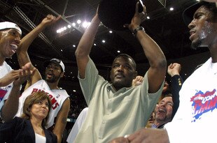 AUBURN HILLS, MI - JUNE 1:  (L-R) Chauncey Billups #1, Rasheed Wallace #30, President of Basketball Operations Joe Dumars (holding trophy) and Ben Wallace #3 of the Detroit Pistons celebrate their win over the Indiana Pacers in Game six of the Eastern Conference Finals during the 2004 NBA Playoffs at The Palace of Auburn Hills on June 1, 2004 in Auburn Hills, Michigan.  The Pistons defeated the Pacers 69-65 and won the 2004 Eastern Conference Championship.  NOTE TO USER: User expressly acknowledges and agrees that, by downloading and/or using this Photograph, user is consenting to the terms and conditions of the Getty Images License Agreement. (Photo by Tom Pidgeon/Getty Images)