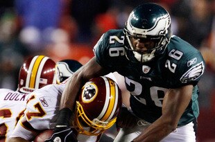 LANDOVER, MD - OCTOBER 26:  Quarterback Jason Campbell #17 of the Washington Redskins avoids a sack by Sean Jones #26 of the Philadelphia Eagles during fourth quarter action at FedEx Field October 26, 2009 in Landover, Maryland. The Eagles won the game 27-17.  (Photo by Win McNamee/Getty Images)