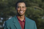 AUGUSTA, GA.- APRIL 14:  Tiger Woods is awarded the green jacket after winning the Masters Tournament at the Augusta National Golf Club on April 14 , 2002 in Augusta, Georgia. DIGITAL IMAGE. EDITORIAL USE ONLY (Photo by Andrew Redington/Getty Images)