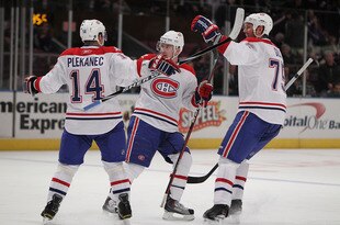 NEW YORK - MARCH 16: Tomas Plekanec #14 of the Montreal Canadiens celebrates an empty net goal with his teammates against the New York Rangers during their game on March 16, 2010 at Madison Square Garden in New York City, New York.  (Photo by Al Bello/Getty Images)