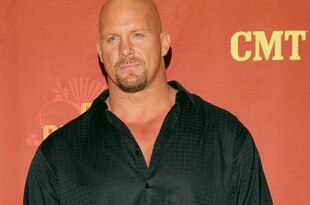 NASHVILLE, TN - APRIL 16:  Wrestler/Presenter Stone Cold Steve Austin poses for a photo in the press room at the 2007 CMT Music Awards at the Curb Event Center at Belmont University April 16, 2007 in Nashville, Tennessee.  (Photo by Evan Agostini/Getty Images)