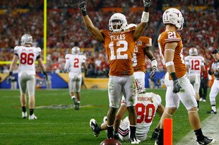 GLENDALE, AZ - JANUARY 05:  Cornerback Earl Thomas #12 of the Texas Longhorns celebrates a defensive stop against Brian Robiskie #80 of the Ohio State Buckeyes during the Tostitos Fiesta Bowl Game on January 5, 2009 at University of Phoenix Stadium in Glendale, Arizona.  (Photo by Jeff Gross/Getty Images)