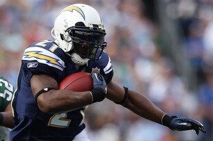 SAN DIEGO - JANUARY 17:  Running back LaDainian Tomlinson #21 of the San Diego Chargers runs with the ball against the New York Jets during the AFC Divisional Playoff Game at Qualcomm Stadium on January 17, 2010 in San Diego, California.  (Photo by Donald Miralle/Getty Images)
