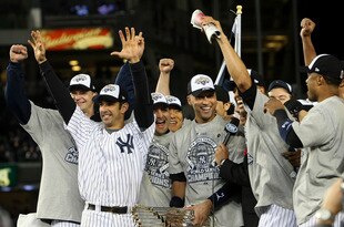 NEW YORK - NOVEMBER 04:  (L-R) A.J. Burnett #34, Jorge Posada #20, Derek Jeter #2 and Mariano Rivera #42 of the New York Yankees celebrate with the trophy after their 7-3 win against the Philadelphia Phillies in Game Six of the 2009 MLB World Series at Yankee Stadium on November 4, 2009 in the Bronx borough of New York City.  (Photo by Nick Laham/Getty Images)