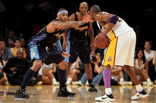 LOS ANGELES, CA - FEBRUARY 28:  Kobe Bryant #24 of the Los Angeles Lakers is defended by Carmelo Anthony #15 of the Denver Nuggets during the second half at Staples Center on February 28, 2010 in Los Angeles, California. The Lakers defeated the Nuggets 95-89.  NOTE TO USER: User expressly acknowledges and agrees that, by downloading and/or using this Photograph, user is consenting to the terms and conditions of the Getty Images License Agreement.  (Photo by Jeff Gross/Getty Images)