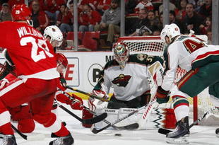 DETROIT - MARCH 11: Josh Harding #37 of the Minnesota Wild makes a save while playing the Detroit Red Wings on March 11, 2010 at Joe Louis Arena in Detroit, Michigan. Detroit won the game 5-1. (Photo by Gregory Shamus/Getty Images)