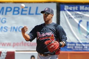 DUNEDIN, FL - MARCH 14: Infielder Yunel Escobar #19 of the  Atlanta Braves flips a baseball after a put out against the Toronto Blue Jays March 14, 2010 at the Dunedin Stadium in Dunedin, Florida. (Photo by Al Messerschmidt/Getty Images)