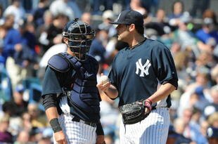 TAMPA, FL - MARCH 5: Pitcher Joba Chamberlain #62 of the New York Yankees talks with catcher Francisco Cervelli #29 after taking the mound in relief against the Tampa Bay Rays March 5, 2010 at the George M. Steinbrenner  Field in Tampa, Florida. (Photo by Al Messerschmidt/Getty Images)