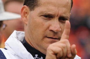 TAMPA, FL - JANUARY 1: Coach Gene Chizik of the Auburn Tigers leaves the field with a win against the Northwestern Wildcats in the Outback Bowl January 1, 2010 at Raymond James Stadium in Tampa, Florida.  (Photo by Al Messerschmidt/Getty Images) 