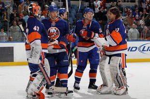 UNIONDALE, NY - MARCH 14:  The New York Islanders celebrate against the Toronto Maple Leafs on March 14, 2010 at Nassau Coliseum in Uniondale, New York. The Isles defeated the Leafs 4-1.  (Photo by Jim McIsaac/Getty Images)