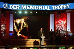 TORONTO, ON - JUNE 14:  Head coach Michel Therrien accepts the Calder Memorial Trophy for Rookie of the Year for Evgeni Malkin of the Pittsburgh Penguins onstage during the 2007 NHL Awards Show at the Elgin Theatre on June 14, 2007 in Toronto, Ontario.  (Photo by Dave Sandford/Getty Images)